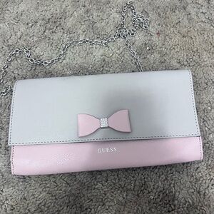 GUESS Two-Tone Bow Accent Clutch